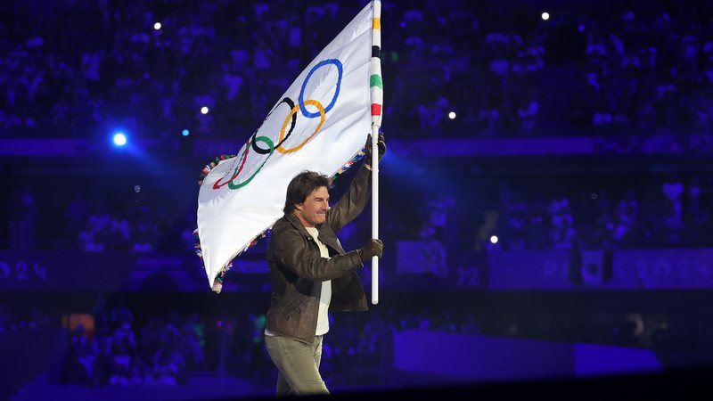 American Actor and Film Producer Tom Cruise carries the IOC Flag during the Closing Ceremony of the Olympic Games Paris 2024 at Stade de France on August 11, 2024 in Paris, France. (Photo by Carl Recine/Getty Images)