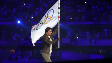 American Actor and Film Producer Tom Cruise carries the IOC Flag during the Closing Ceremony of the Olympic Games Paris 2024 at Stade de France on August 11, 2024 in Paris, France. (Photo by Carl Recine/Getty Images)