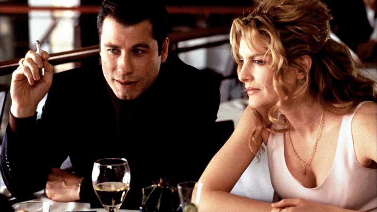 Travolta e Rene Russo - divulgação