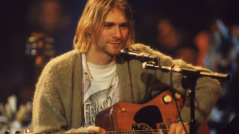 Kurt Cobain à frente do Nirvana em cena do DVD <i>MTV Unplugged</i> - Reprodução