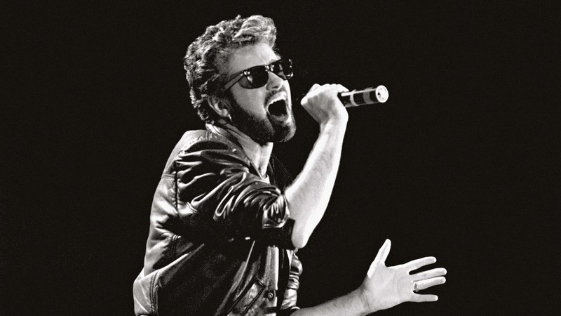 <b>Som & Visual</b><br>George Michael ao vivo no Live Aid, no dia 13 de julho de 1985. Nessa época, ele ainda estava no Wham! - Press Association via ap images