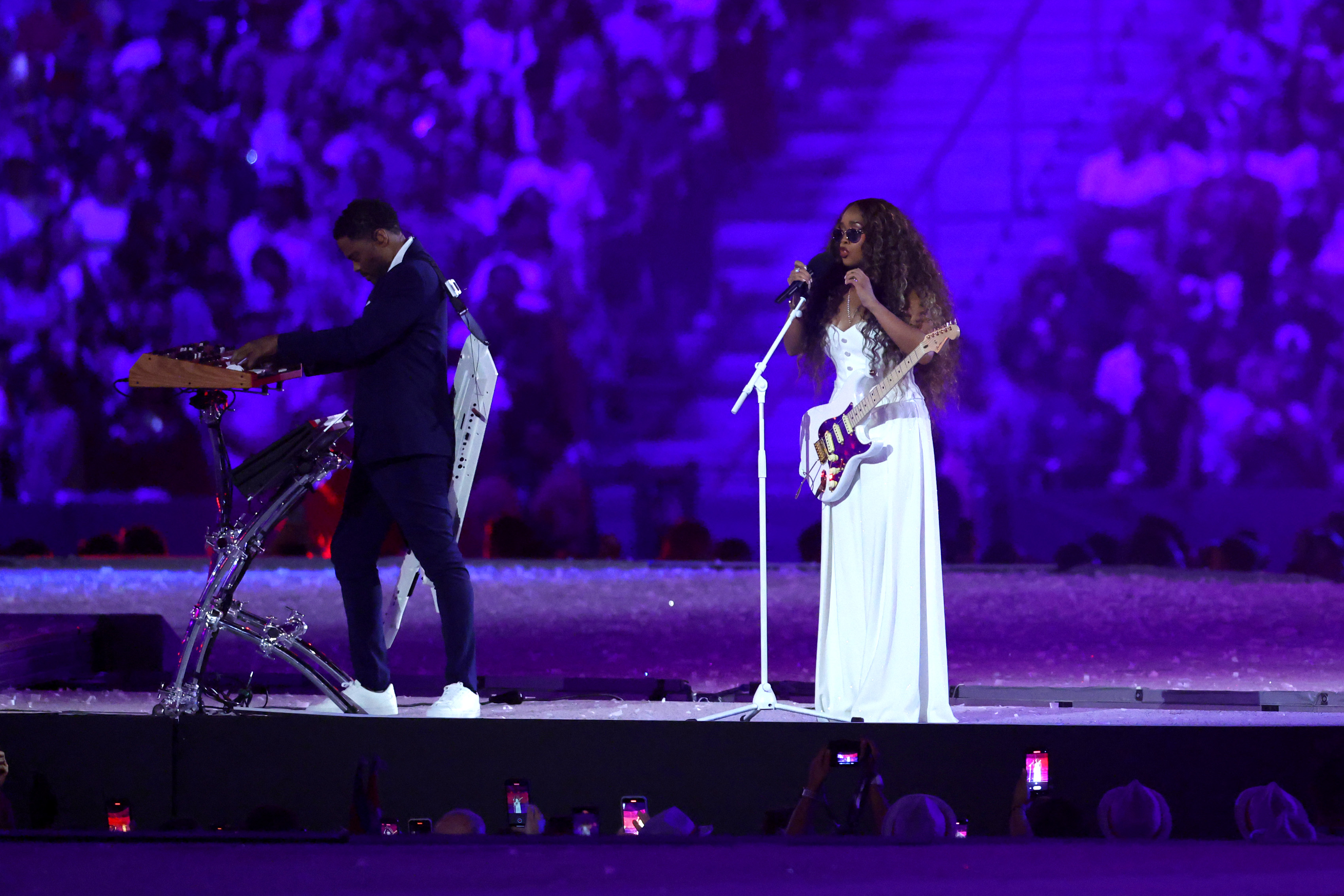 American Singer H.E.R. performs the National Anthem of the United States of America during the Closing Ceremony of the Olympic Games Paris 2024 at Stade de France on August 11, 2024 in Paris, France. (Photo by Pascal Le Segretain/Getty Images)
