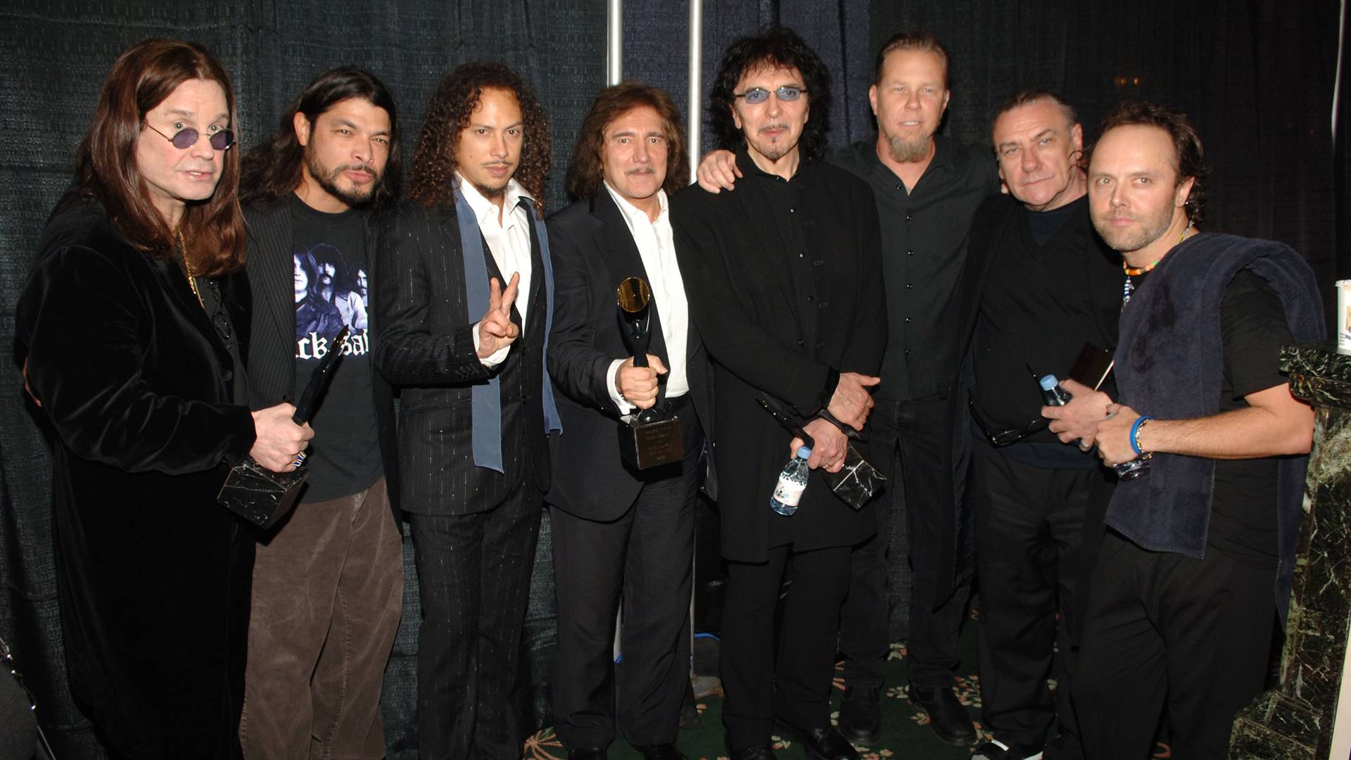 Músicos do Black Sabbath e Metallica (D-E): Ozzy Osbourne, Robert Trujillo, Kirk Hammett, Geezer Butler, Tony Iommi, James Hetfield, Bill Ward e Lars Ulrich