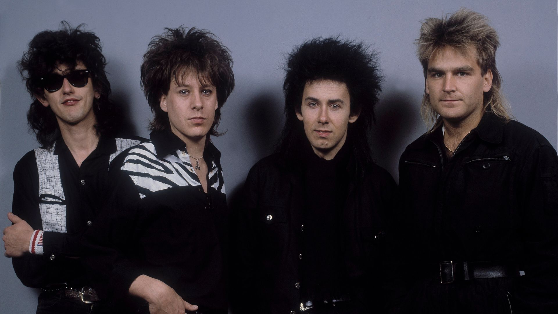 The Alarm em 1985 (E-D): Nigel Twiste, Dave Sharp, Eddie Macdonald e Mike Peters