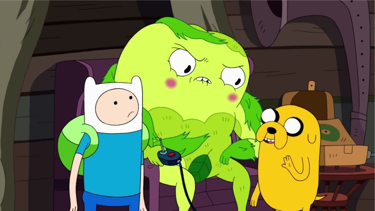 Donny sentado junto a Finn e Jake. Ele segura o controle de videogame do BMO.