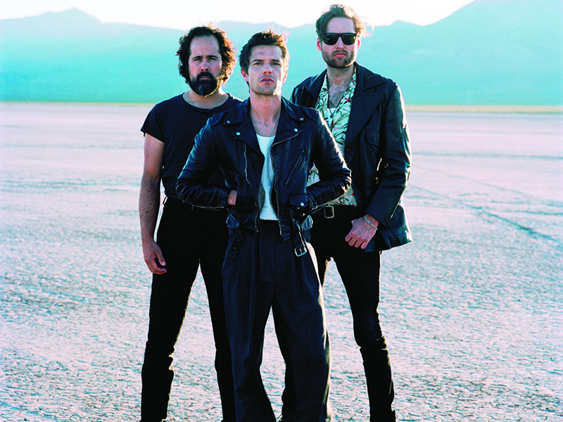 Ronnie Vannucci, Brandon Flowers e Mark Stoermer: compondo com sentimento