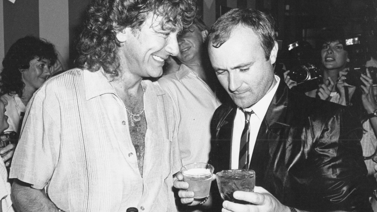 Robert Plant e Phil Collins (Foto: Gary Gershoff / MediaPunch/IPX)